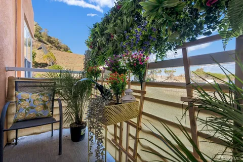 a view of balcony with furniture
