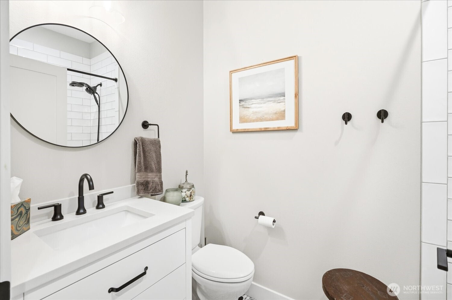 1855 Woodmere Loop Walla Walla, WA 99362 - Photo 11 of 22 a bathroom with a toilet sink vanity and mirror