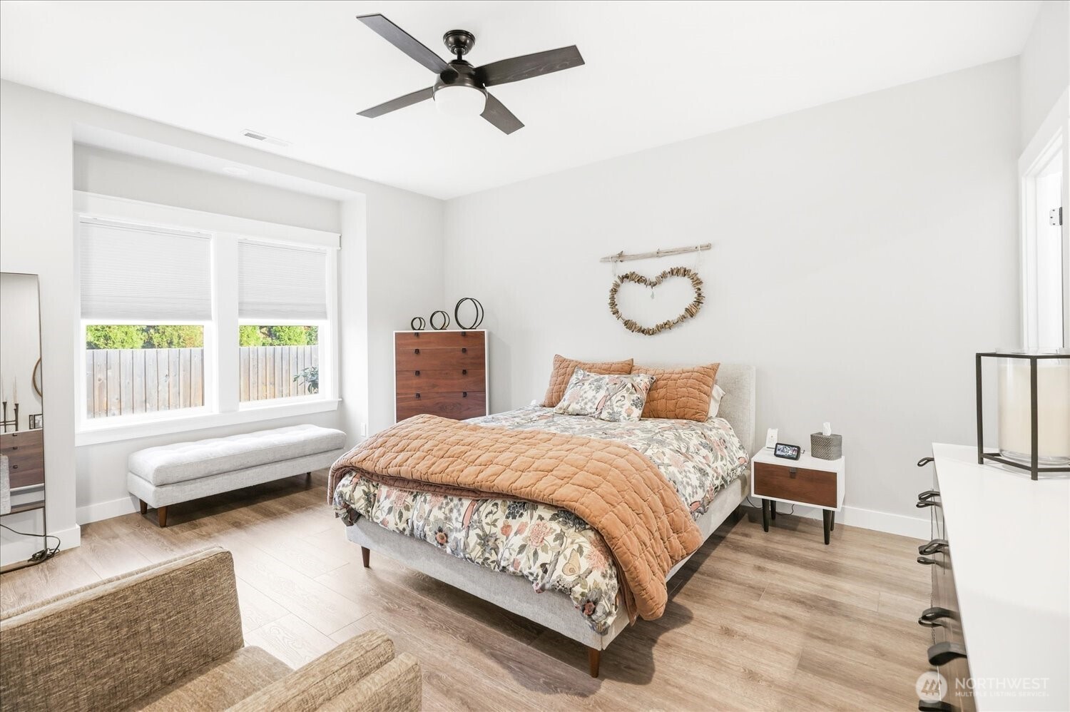 1855 Woodmere Loop Walla Walla, WA 99362 - Photo 14 of 22 a bedroom with a bed and wooden floor