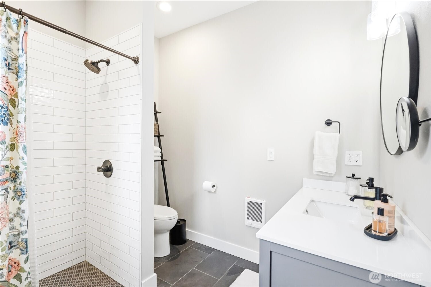 1855 Woodmere Loop Walla Walla, WA 99362 - Photo 15 of 22 a bathroom with a sink and a mirror