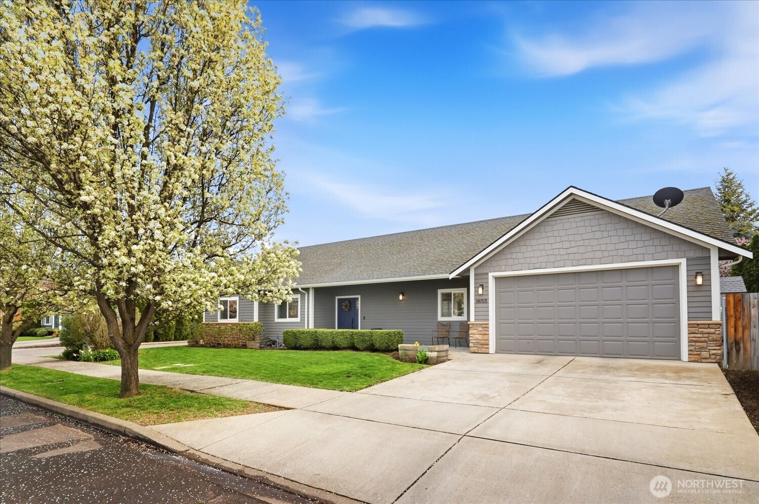 1855 Woodmere Loop Walla Walla, WA 99362 - Photo 16 of 22 a front view of a house with a yard and garage