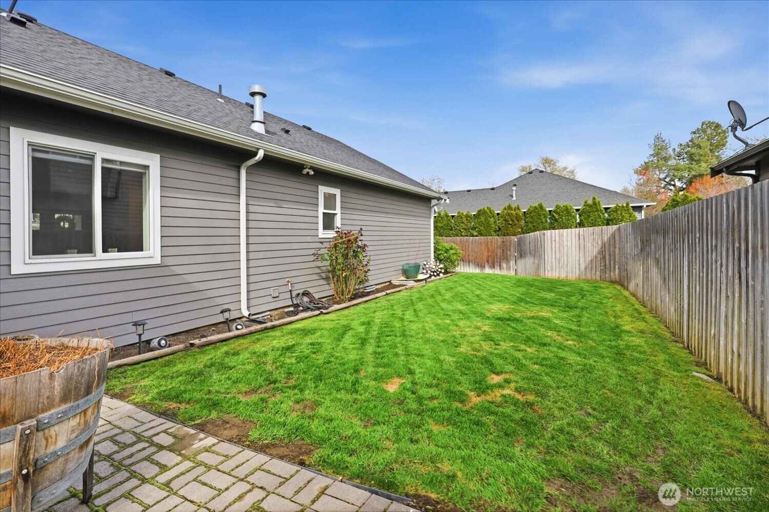1855 Woodmere Loop Walla Walla, WA 99362 - Photo 22 of 22 a view of backyard with a garden and plants