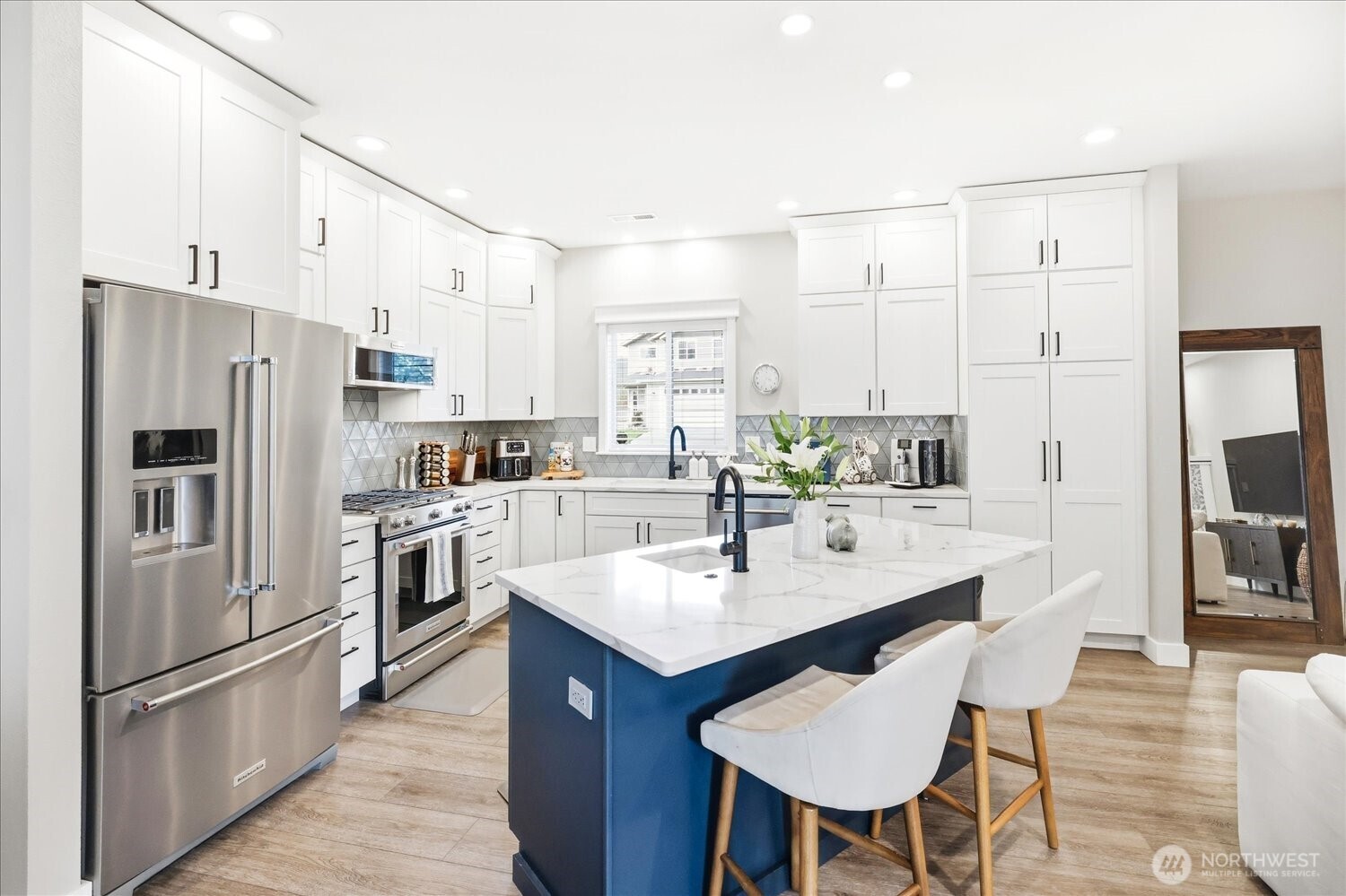 1855 Woodmere Loop Walla Walla, WA 99362 - Photo 6 of 22 a kitchen with stainless steel appliances a sink and a refrigerator