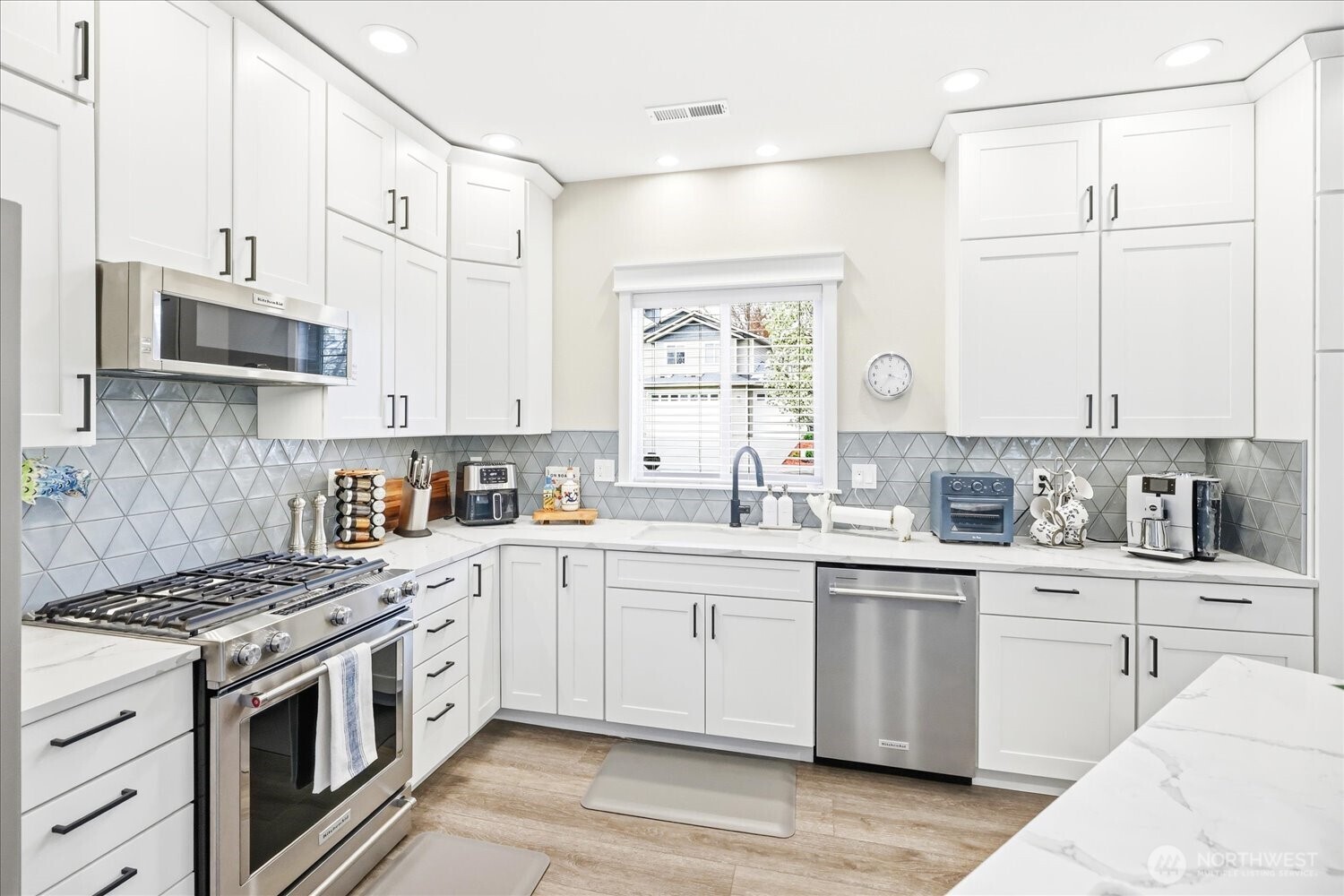 1855 Woodmere Loop Walla Walla, WA 99362 - Photo 7 of 22 a kitchen with white cabinets sink and appliances