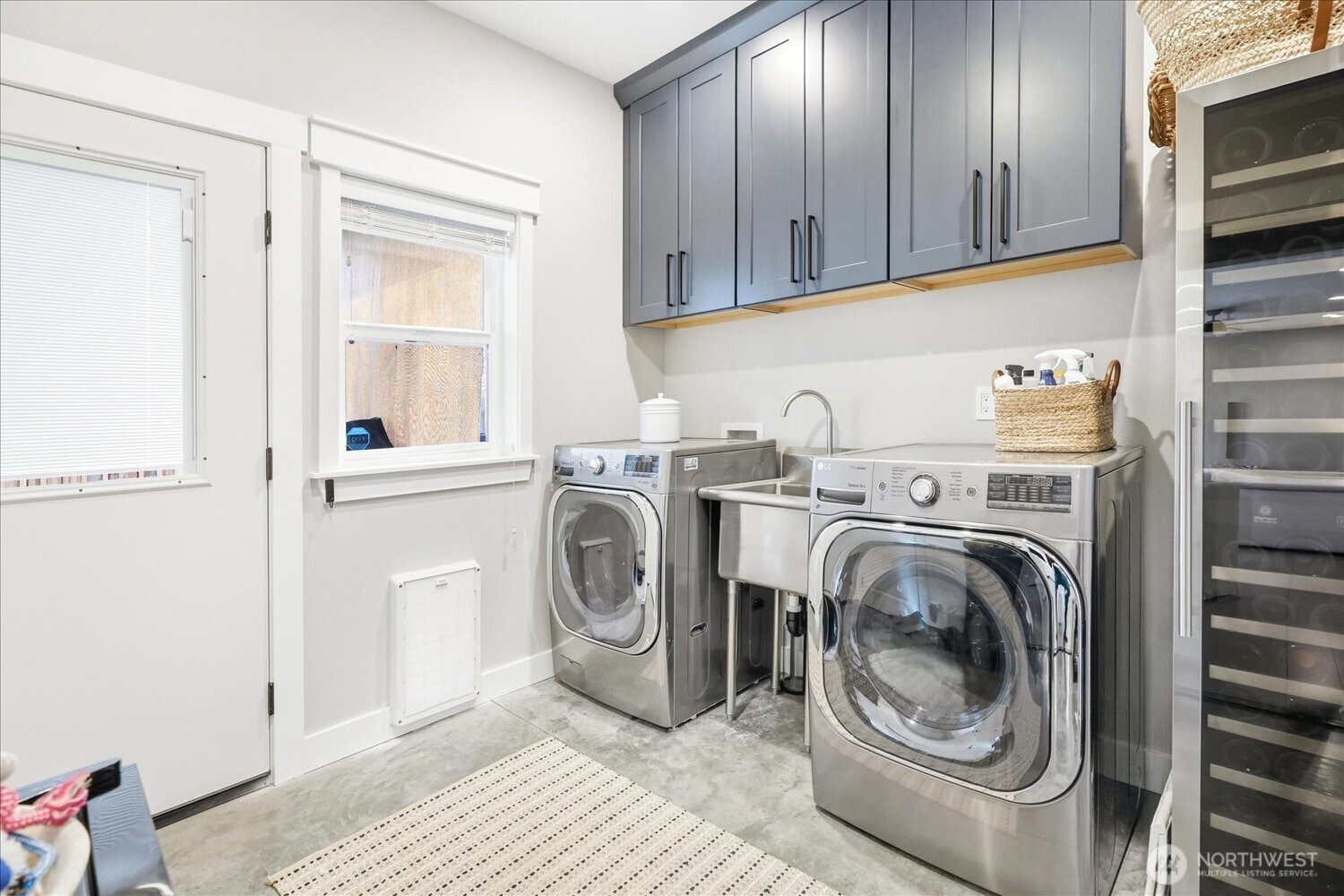 1855 Woodmere Loop Walla Walla, WA 99362 - Photo 9 of 22 a utility room with sink dryer and washer