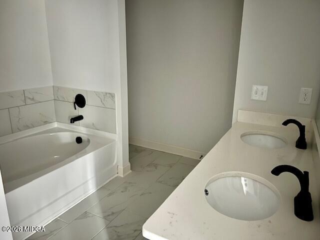 228 Trellis Walk Macon, GA 31220 - Photo 17 of 22 a bathroom with a tub a sink and mirror