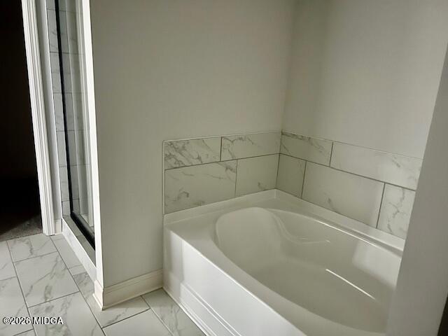 228 Trellis Walk Macon, GA 31220 - Photo 18 of 22 a bathroom with a bathtub