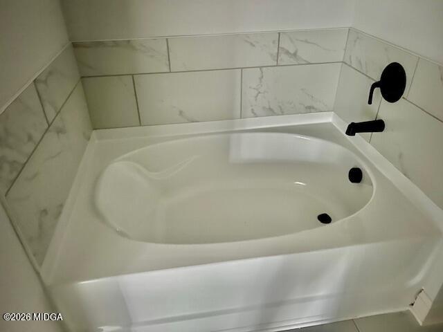 228 Trellis Walk Macon, GA 31220 - Photo 20 of 22 a bathroom with a tub