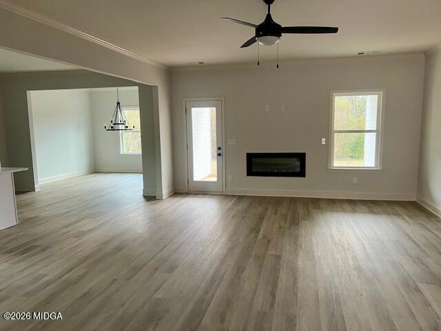 228 Trellis Walk Macon, GA 31220 - Photo 4 of 22 an empty room with wooden floor cabinet and windows