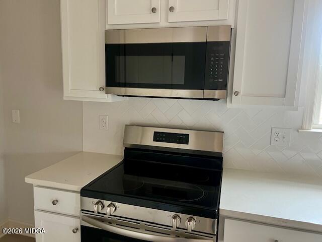 228 Trellis Walk Macon, GA 31220 - Photo 9 of 22 a kitchen with microwave cabinets and stove top oven