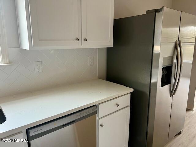 228 Trellis Walk Macon, GA 31220 - Photo 10 of 22 a kitchen with metallic refrigerator and cabinet