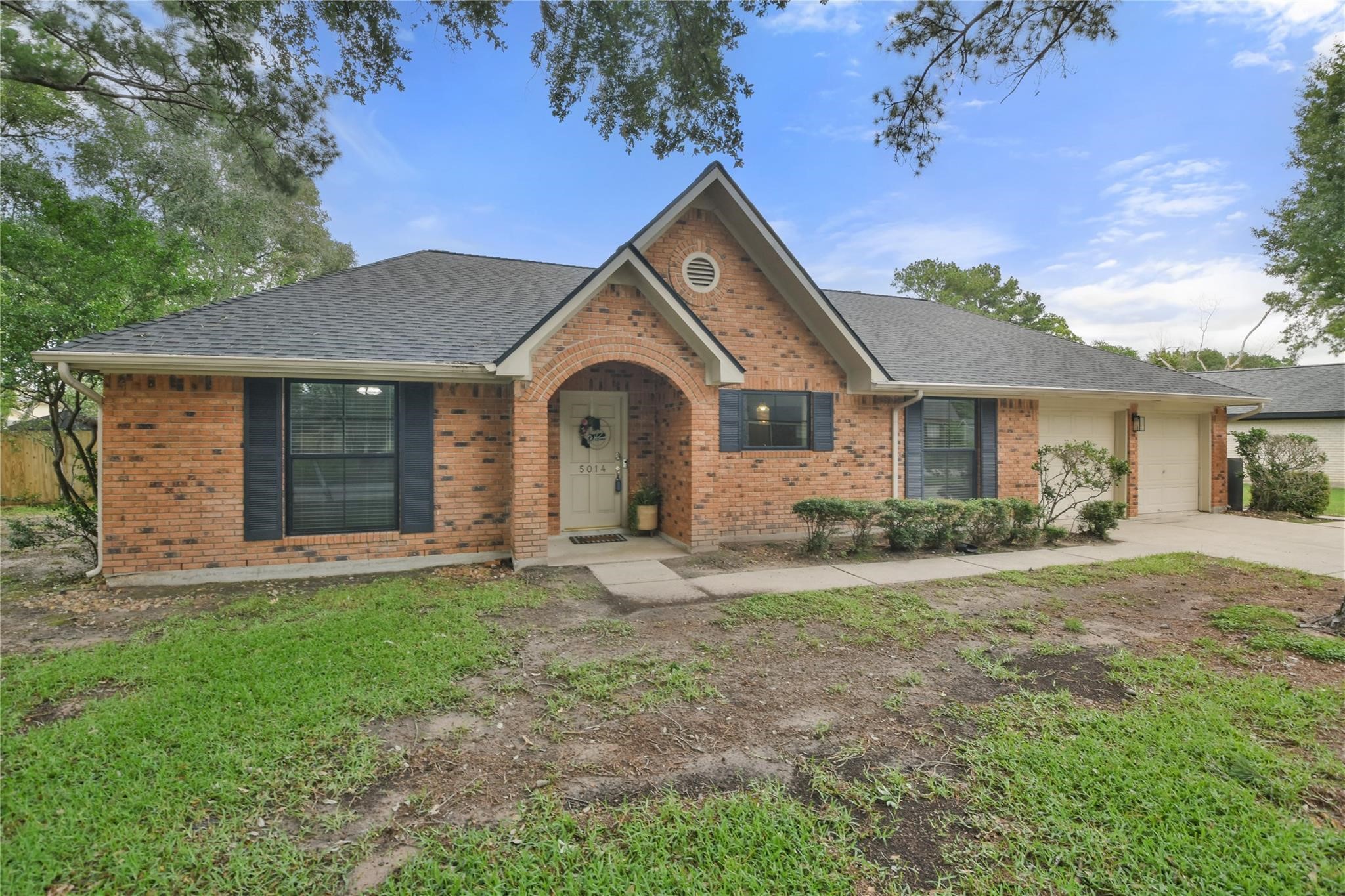 5014 Temple Bell Drive Spring, TX 77388 - Photo 2 of 30 Home is nestled under mature trees