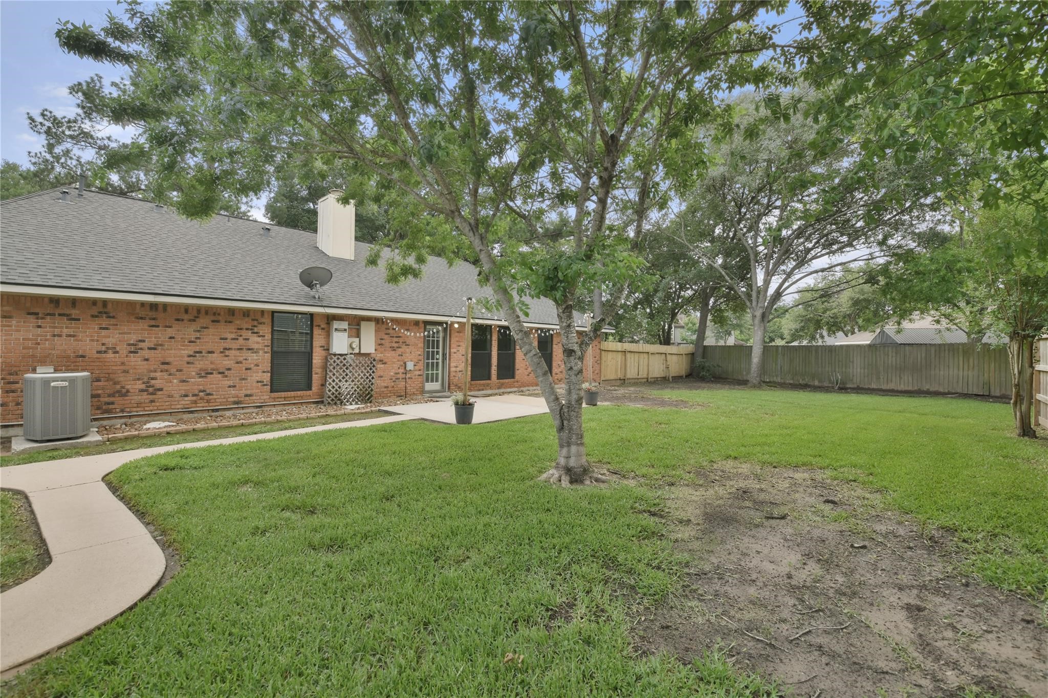 5014 Temple Bell Drive Spring, TX 77388 - Photo 27 of 30 Backyard with shade trees and patio