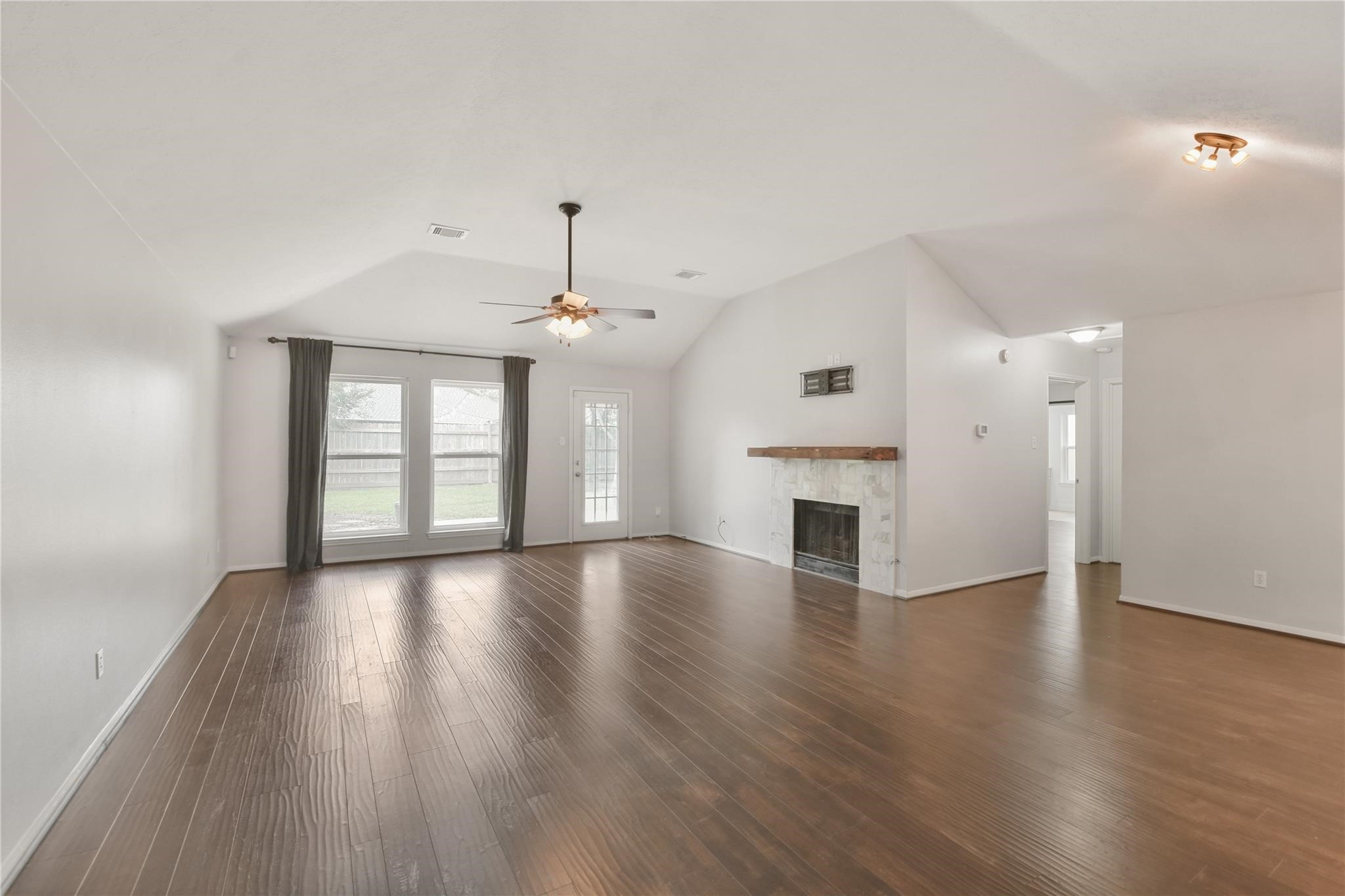 5014 Temple Bell Drive Spring, TX 77388 - Photo 5 of 30 Spacious family room with cozy fireplace and access to the backyard