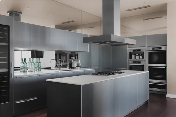 a kitchen with kitchen island stainless steel appliances a sink stove and refrigerator