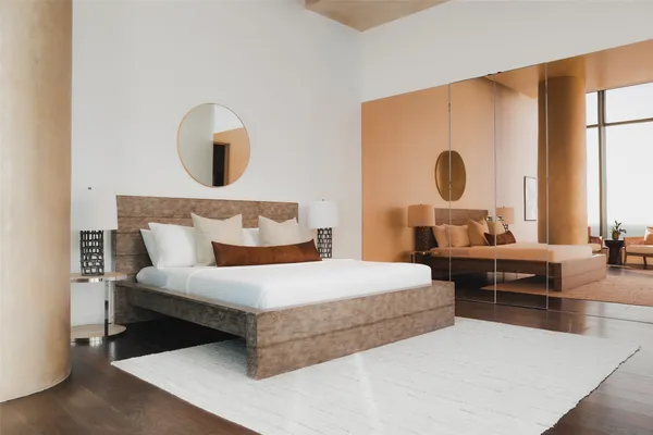 a bedroom with a bed and window