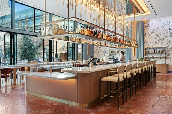 a view of a kitchen with furniture and chandelier