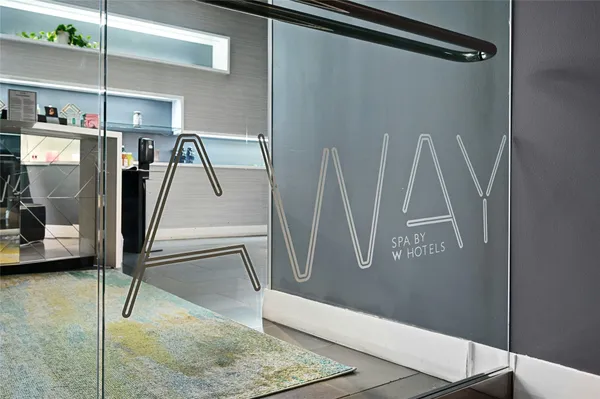 a bedroom with a bed and dresser