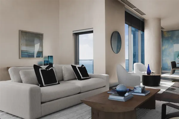 a living room with furniture and a mirror