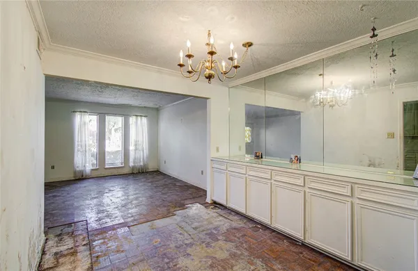 a bathroom with a granite countertop sink a toilet and bathtub
