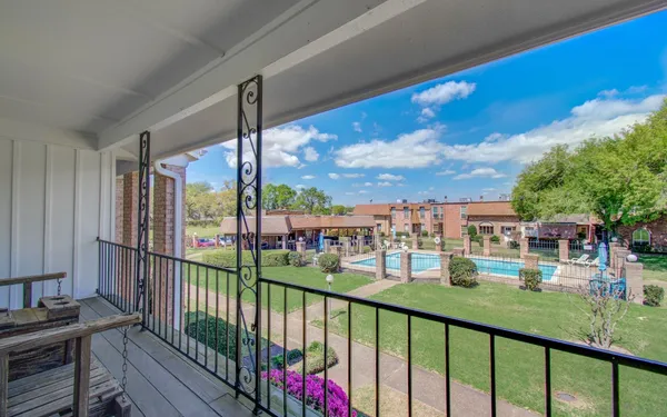 a view of a porch with a big yard