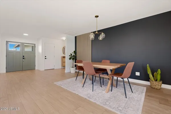a dining room with furniture and window
