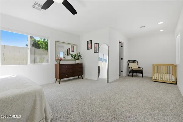 a bedroom with a bed and a cabinets