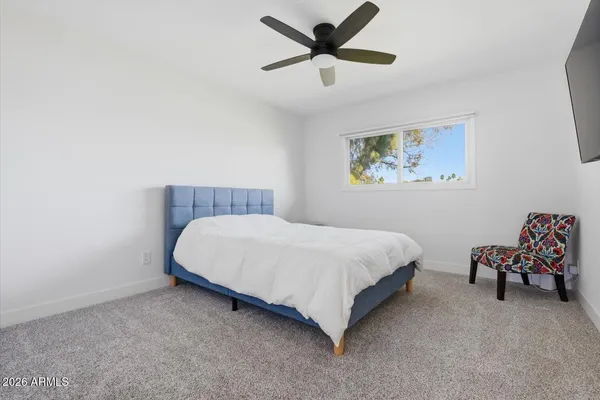 a bedroom with furniture and a bed