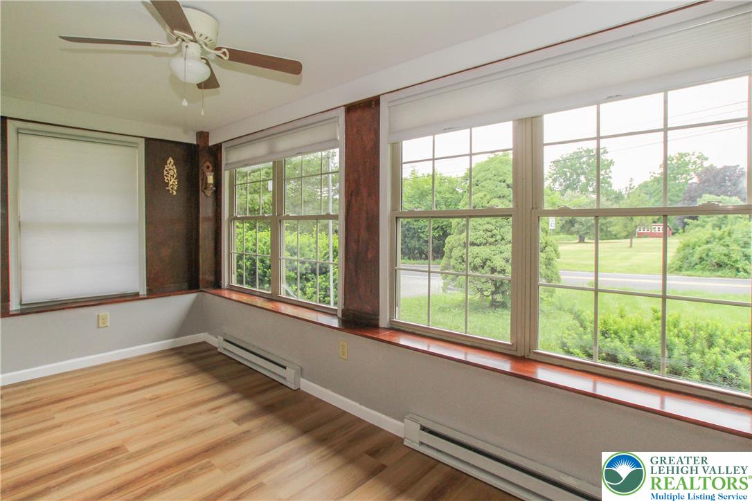 492 Filetown Road Nazareth, PA 18064 - Photo 10 of 30 A naturally illuminated room boasts gleaming hardwood flooring and verdant outdoor views.