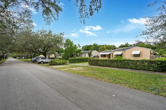 a view of street with parked cars