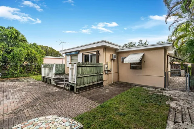a front view of a house with parking space