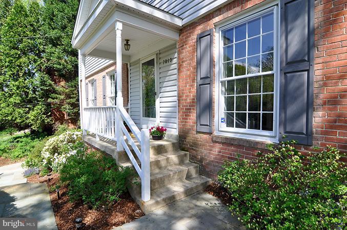 7613 Sebago Road Bethesda, MD 20817 - Photo 1 of 26 a front view of a house with a yard