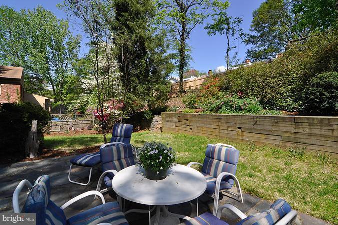 7613 Sebago Road Bethesda, MD 20817 - Photo 12 of 26 a backyard of a house with outdoor seating