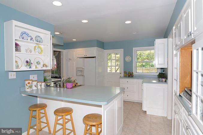 7613 Sebago Road Bethesda, MD 20817 - Photo 18 of 26 a kitchen with stainless steel appliances granite countertop a sink and cabinets