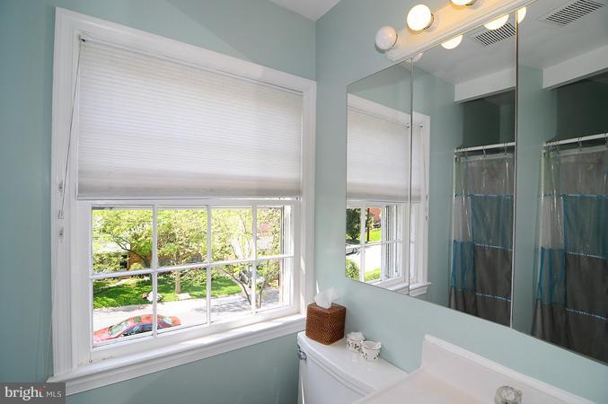 7613 Sebago Road Bethesda, MD 20817 - Photo 23 of 26 a bathroom with a bathtub and a sink
