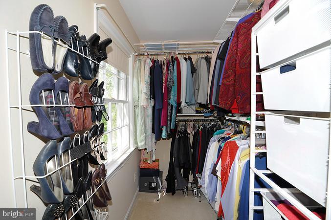 7613 Sebago Road Bethesda, MD 20817 - Photo 4 of 26 a view of walk in closet with clothes and shoes