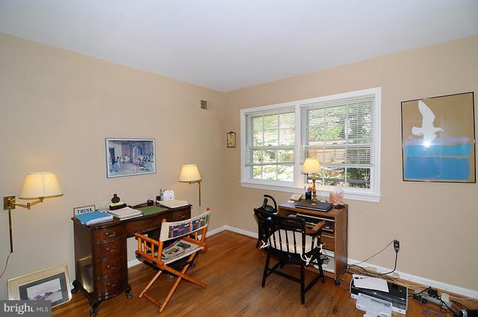 7613 Sebago Road Bethesda, MD 20817 - Photo 5 of 26 a workspace with furniture and a window