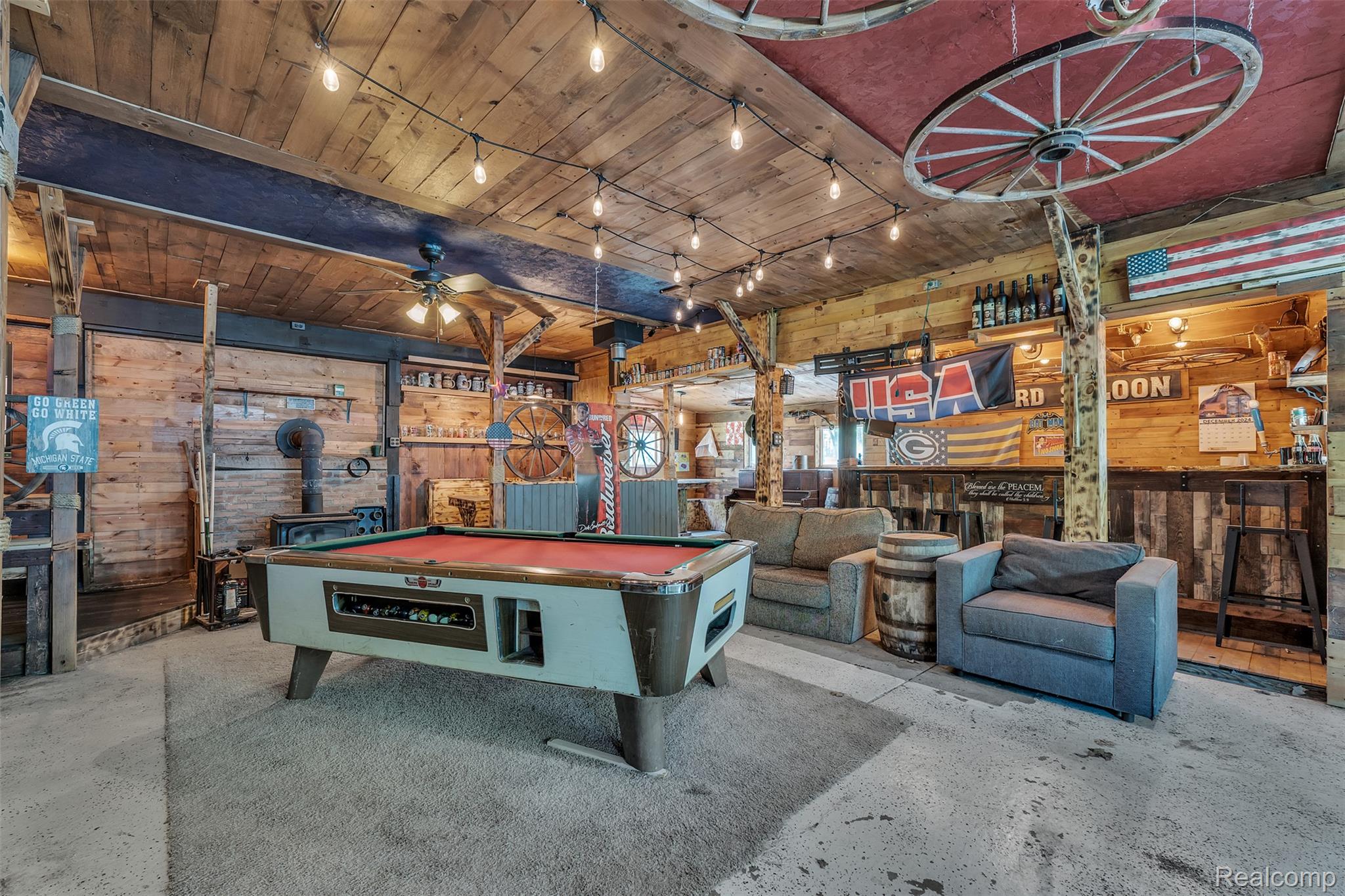 1345 Ives Road Mason, MI 48854 - Photo 48 of 92 Game room with a wood stove, wooden walls, track lighting, a ceiling fan, and billiards