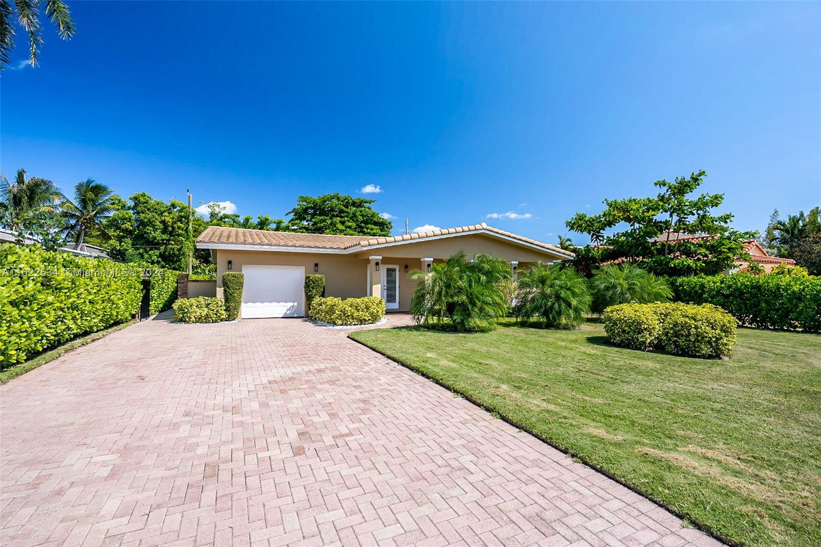160 Northeast Wavecrest Court Boca Raton, FL 33432 - Photo 21 of 52 a front view of a house with garden