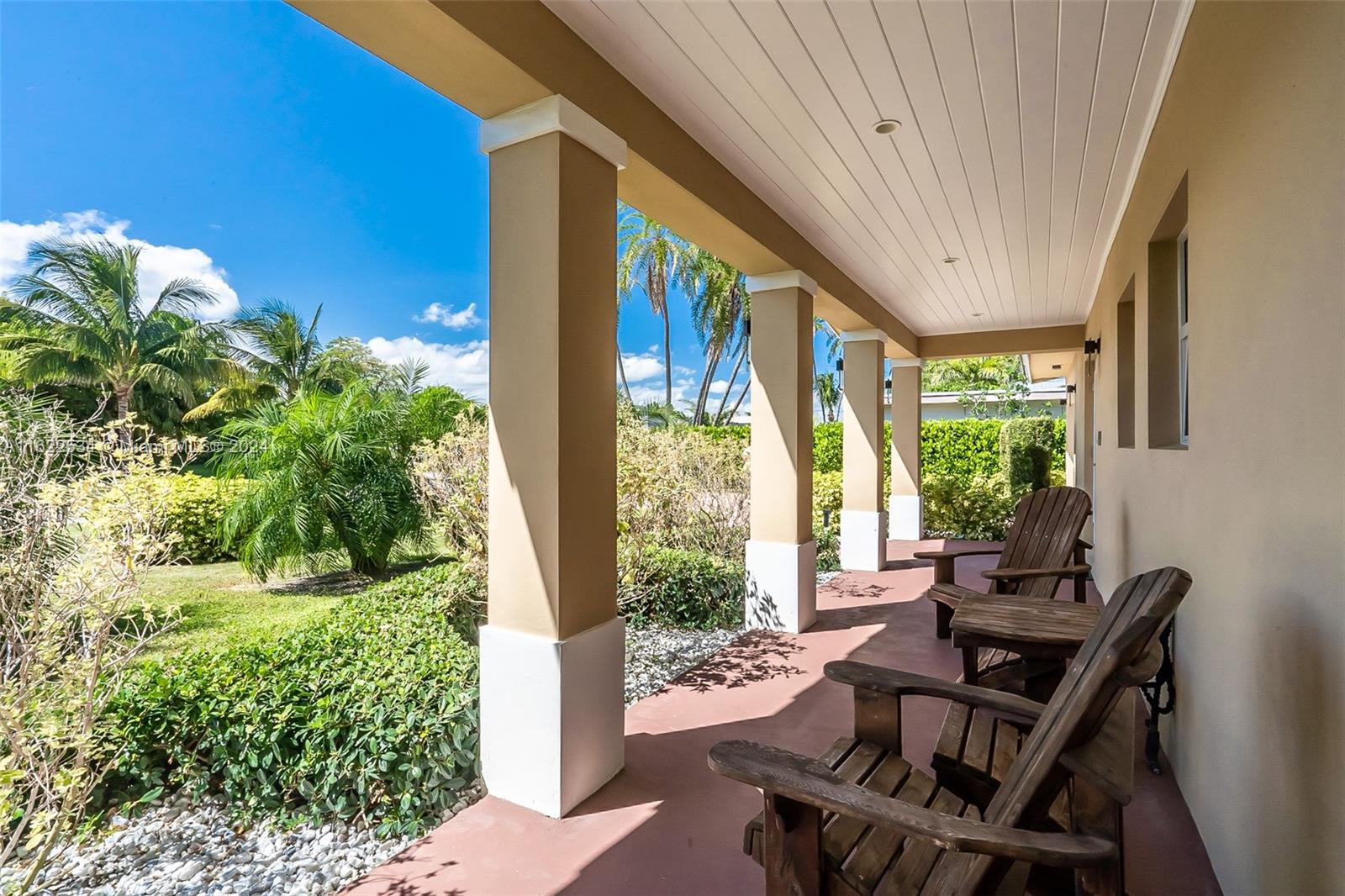160 Northeast Wavecrest Court Boca Raton, FL 33432 - Photo 23 of 52 a view of a patio with table and chairs and potted plants