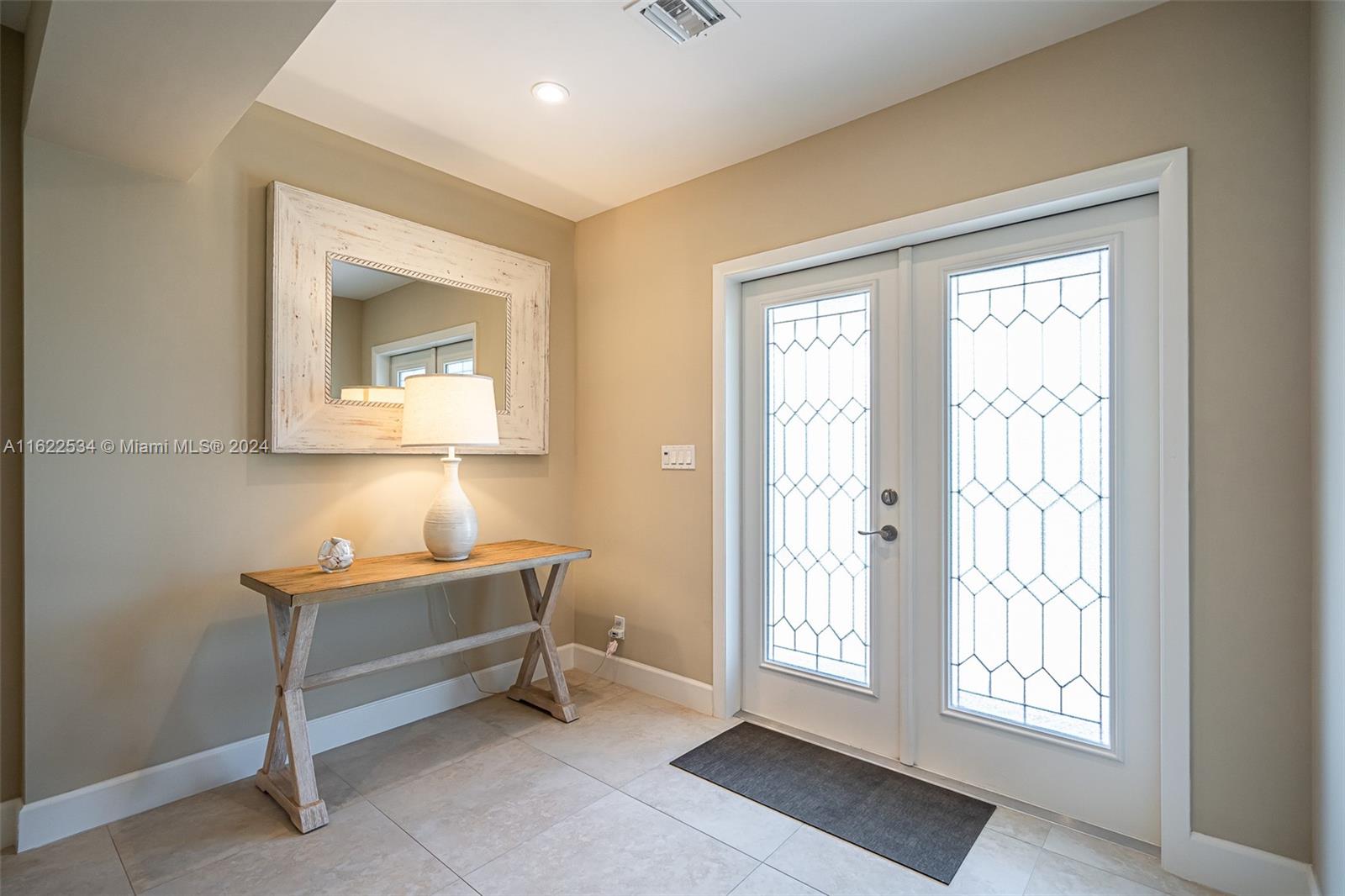 160 Northeast Wavecrest Court Boca Raton, FL 33432 - Photo 24 of 52 a room with table and window