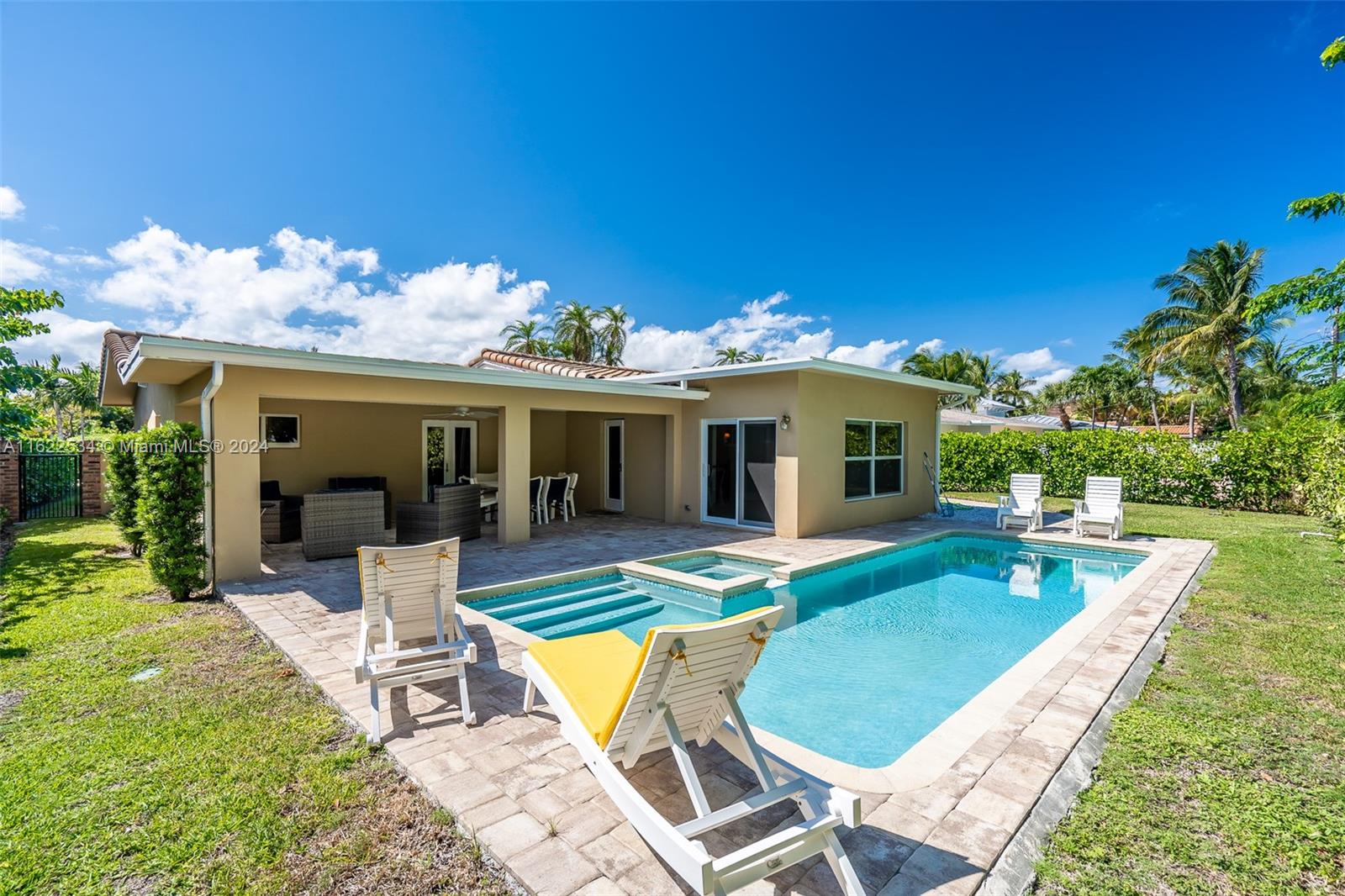 160 Northeast Wavecrest Court Boca Raton, FL 33432 - Photo 49 of 52 a view of a house with pool porch and chairs