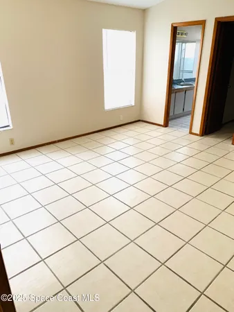 a bathroom with a sink a toilet a mirror and shower