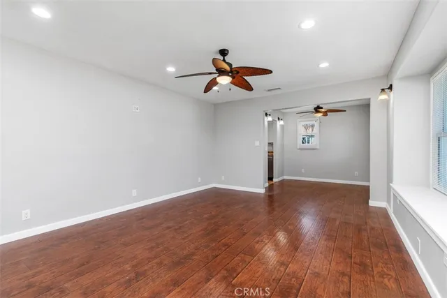 a view of room with wooden floor