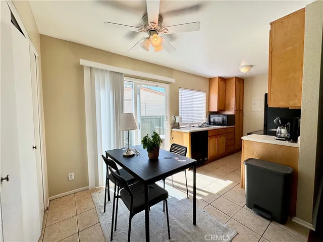 a kitchen with a table and chairs in it