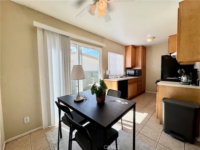 a view of a dining room with furniture and window