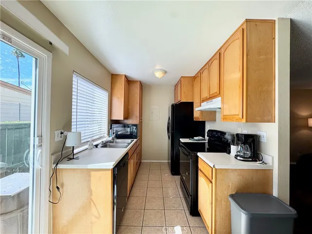 a kitchen that has a cabinets and a stove top oven
