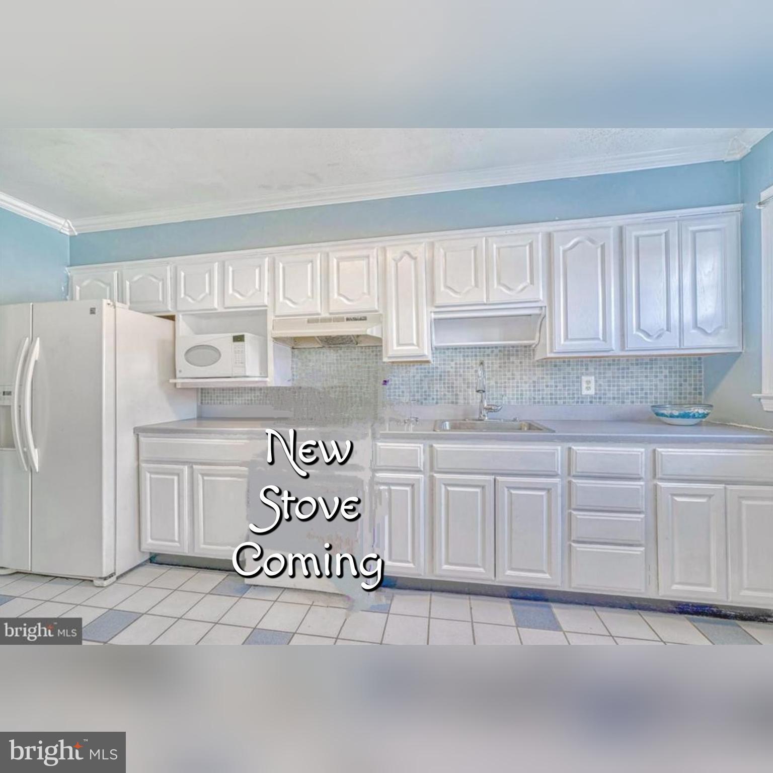 8148 Gray Haven Road Dundalk, MD 21222 - Photo 10 of 34 Fresh white cabinets & new stove coming