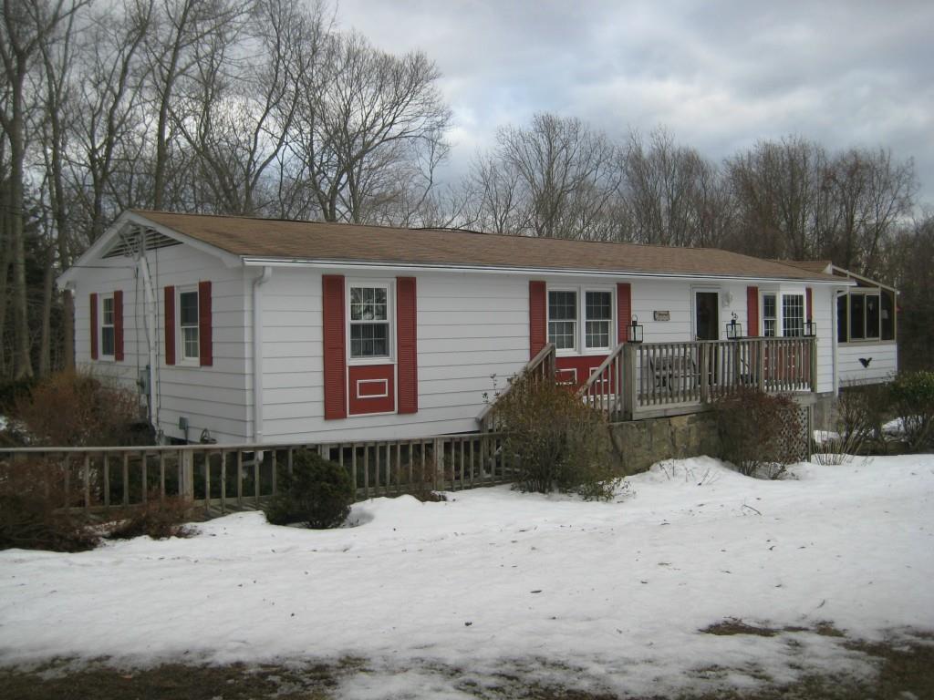 42 Mattern Road Preston, CT 06365 - Photo 1 of 1 a front view of a house with a yard covered in snow