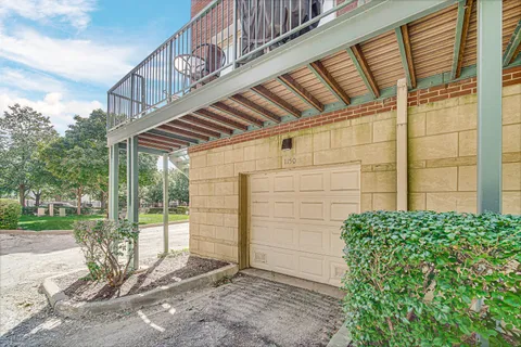 a view of a house with a large windows and stairs